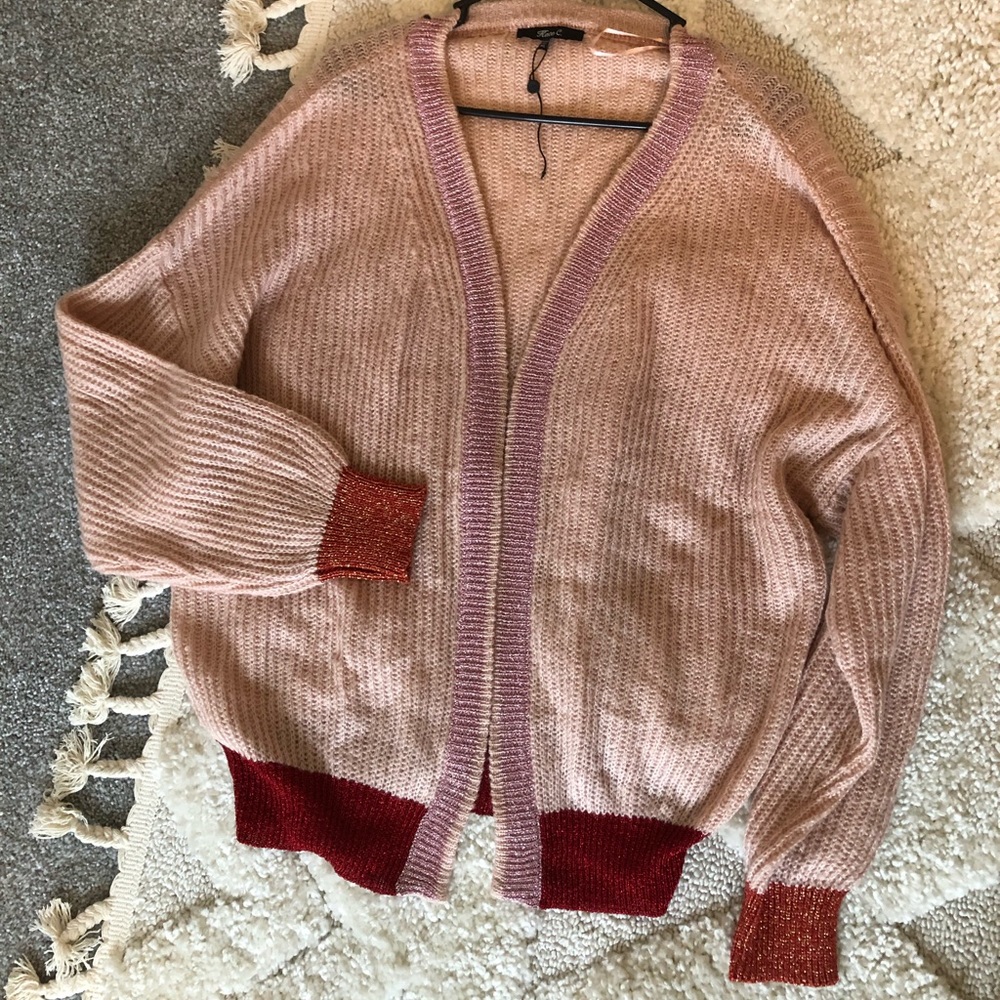 Soft pink sweater with colored sparkle detail
